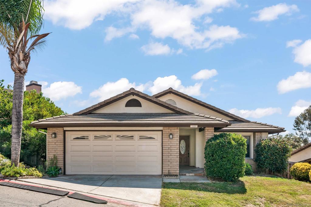 Welcome to this beautifully updated home in the highly desirable gated Cimarron community. As you enter, you’re greeted by an open-concept living space with soaring ceilings and windows that overlook stunning canyon & mountain views. The living room, complete with a cozy fireplace, flows into the dining area and upgraded kitchen featuring granite countertops, stainless steel appliances, & recessed lighting. A conveniently located bedroom and full bathroom complete this level. Downstairs, the spacious primary suite offers a walk-in closet, a full bathroom, & direct access to the backyard. A third bedroom and additional full bathroom are located down the hall, along with a generous storage area — perfect for keeping everything neatly tucked away. Cimarron provides a peaceful and private setting with resort-style amenities including a pool, clubhouse, tennis courts, fitness center, & scenic trails. Ideally located just minutes from Daley Ranch, Lake Dixon, shopping, dining, and closest beach is 25 mins away! HOA fees include trash service!
