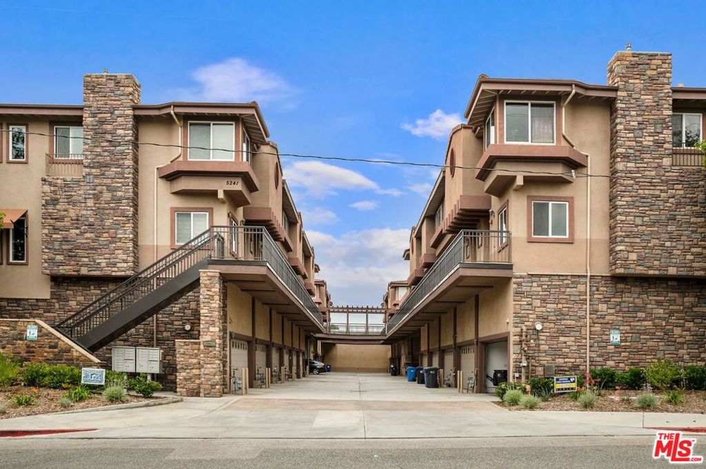 Discover the charm of Old Agoura Hills in this spectacular townhome, perfectly situated in a serene and highly desirable neighborhood. This beautifully designed residence features an open floor plan with rich wood flooring and a spacious dining area that flows seamlessly into a cook's kitchen. Just off the living room, a large private patio invites you to enjoy outdoor dining and entertaining. Upstairs, the master suite includes a luxurious spa-style bathroom with a soaking tub and separate shower, and an oversized walk-in closet. Two additional bedrooms, with mountain views, share a full bath and are conveniently located near the laundry room. On the ground level, a private garage provides direct access to the home, along with a versatile 160+ square foot bonus room - ideal for a home office, gym, workshop, or storage. The community features a relaxing pool and a recreation room complete with a billiard table and kitchen. Located within the top-rated Las Virgenes Unified School District, known for its investment in STEM education, this home is also just steps from Old Agoura Park and scenic hiking trails. Nearby shopping includes Trader Joe's, Target, and Costco, with a variety of fine dining and casual restaurants close by. Come experience why Agoura Hills proudly lives up to its motto: "The Good Life."