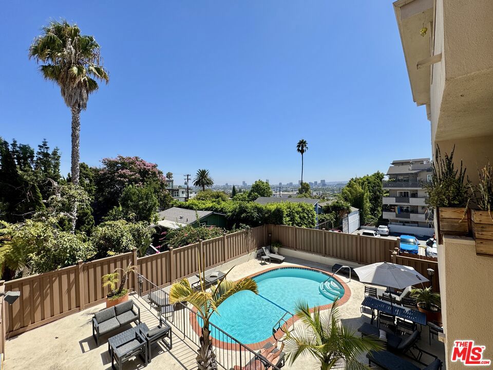Welcome to the Palm Holloway Residence. South of Sunset and North of Santa Monica Blvd, this 2nd floor corner unit condominium is located in the back of the building, a peaceful corner unit with a large enclosed patio welcoming fresh air and privacy. This unit has central air conditioning but also a really nice natural cross breeze. With a Botch dishwasher and Stainless Steel Refrigerator, Oven and Electric Stove. Spacious formal dining room, open concept living room, enclosed covered patio, and a spacious master bedroom with a walk-in closet and built-in's. Dimmable recessed lights. Shower over tub in the bathroom with a good amount of storage in the unit and a storage unit in the garage. One car parking in the gated covered garage. Community laundry. Enjoy a swim in the community pool and sunbathe in privacy. Perfectly located in Prime Weho, close to Dialog Cafe, Viper Room, Trader Joe's, located between Sunset Blvd and Santa Monica Blvd.