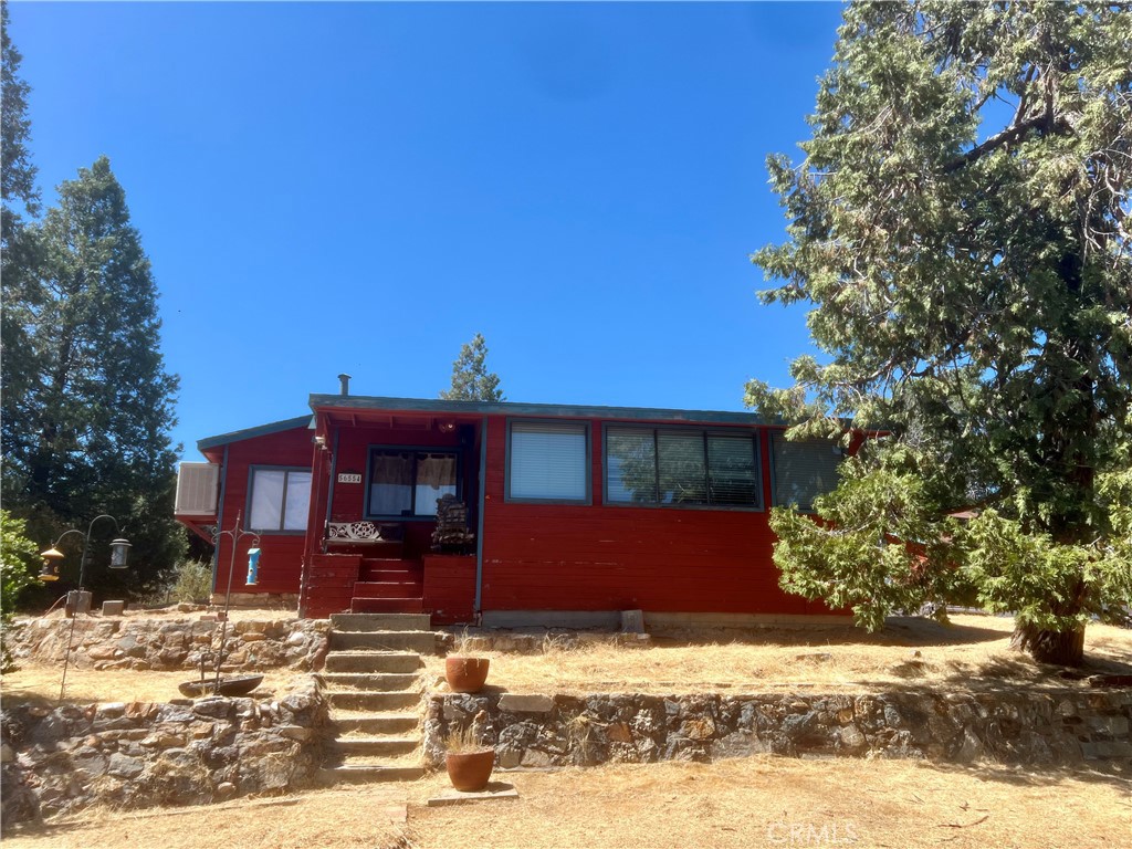 CALLING ALL INVESTORS! A diamond in the rough, ideally located in the heart of the Sierra with peek-a-boo views of Pekinpah Ridge and Whiskey Ridge. This 2 bedroom 1 bathroom, fixer-upper would make a great AirBNB being located near Bass Lake, Redinger Lake and Yosemite National Park. Would you rather customize your dream home? You will enjoy tinkering around in the workshop with an attached outbuilding. Ample amount of area to create an outdoor living space for bbq's or just relaxing while breathing in the fresh mountain air and stargazing. This is the opportunity you have been waiting for. Call your favorite Realtor to schedule a showing before it's gone.