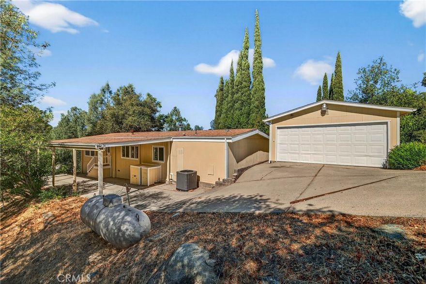 Welcome to the Kelly Ridge Community! Just minutes from Bidwell full-service marina and Oroville Dam. This home is ready for a new owner. The 1,680 square foot home offers a large living room and separate family room! Newer 2022 Ac unit, upgraded dual pane windows, luxury plank flooring throughout, newer roof, updated interior and exterior paint, primary bath vanities, updated shower/tub in both bathrooms. This home has a private setting with the lot to the south has no home. The kitchen has vaulted ceilings, built in propane range, dishwasher, built in oven, pantry, tons of cabinets, stainless sink and breakfast nook area. The living room off the double door entry has vaulted ceilings, private views and transom windows above the picture windows. Off the huge laundry room is a second living room with built in bookcase. The primary bathroom has 2 vanities, tub/shower combination and linen cabinet. The guest bath also offers a tub/shower combination. Off the kitchen is a concrete patio measuring 13'X35'. The covered carport measures 10'X46'. The detached two car garage has keyless entry, window and back man door entrance. This home is move in ready! Enjoy all Lake Oroville and the surrounding foothills has to offer.