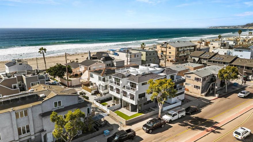 Introducing the Fantasket 3 Townhomes, a sleek and modern coastal Cape Cod–style new construction development featuring three luxury residences on the ocean side of Mission Beach. Built by a highly reputable local builder and backed by a full builder warranty, this 4-bedroom, 4-bath home spans three thoughtfully designed levels and offers the ultimate in low-maintenance, luxury beach living. The first floor features a versatile bedroom or ideal home office with direct front patio access, a full bath, laundry closet, and a direct-access tandem two-car garage. On the second floor, enjoy an open-concept living space with a balcony, a modern kitchen with stainless steel appliances, a dining area, and a bedroom and a full bath. The third floor showcases a primary suite with a spa-inspired bathroom and private balcony, along with another spacious ensuite bedroom that also enjoys its own balcony. A private rooftop deck crowns the home, offering 360° panoramic views of Mission Beach, the Pacific Ocean, and Mission Bay—ideal for entertaining or sunset relaxation. Additional highlights include Atlantis waterproof luxury vinyl plank flooring, designer finishes, wainscoting accents, central heating and A/C splits, and in-unit laundry. Just steps from the sand and walking distance to Belmont Park, Bonita Cove, Fit Athletic Club, The Plunge, and popular dining destinations, this townhome is perfectly suited for full-time coastal living, a vacation retreat, or a premium investment property. Don't miss out.