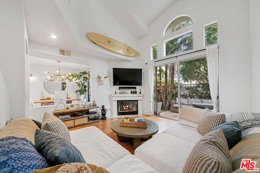 Tastefully updated townhome in The Pointe for lease! This pristine two-level unit offers a perfect central location in one of Malibu's most desirable gated communities. A welcoming entryway opens up to a well-appointed layout with a light and bright interior and luxury finishes, including hardwood floors and recessed lighting. The living room features soaring ceilings, skylights, a gas fireplace, and outdoor access. A fully equipped kitchen offers Viking appliances, granite countertops, a breakfast bar, and seamlessly connects to the dining area. Sliding glass doors in the dining and living rooms lead out to a fully enclosed backyard patio with tropical landscaping, a dining and seating area, and gated access to a tree-lined walking pathway. Upstairs, the primary suite boasts vaulted ceilings and looks out to a private balcony with peaceful views of the swaying palm trees. An en-suite bathroom features dual vanities, a shower, a deep-soaking tub, and a walk-in closet. Down the hallway, there are two additional bedrooms that share an updated full bathroom. Additional features include an entry-level powder room, Nest thermostat, 2-car garage, driveway, and guest parking. The Pointe boasts some of Malibu's finest luxury amenities, and the tenant will enjoy use of the community pool/spa, tennis court with lights, a fully-equipped gym, and meticulously landscaped grounds. Located moments from Point Dume, local markets, sandy beaches, schools, and more! Available now.