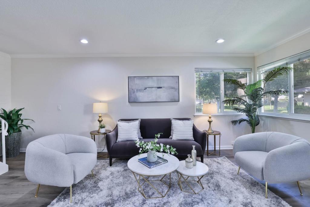 Step into this beautifully refreshed 2 bedroom, 1 bathroom condo offering comfort, convenience, and style. Freshly painted with brand-new plush carpet upstairs, the home also features recessed lighting and sleek laminate flooring in the living area for a modern touch. The kitchen is well-appointed with stainless steel appliances, plus a convenient pantry (which can be converted to in-unit laundry with HOA approval). The updated bathroom adds a contemporary flair, while generous storage options include multiple closets and a spacious walk-in closet in the primary bedroom. Enjoy the perks of a well-maintained community complete with lush trees, grassy courtyards and a community swimming pool. The unit includes one assigned carport, additional storage, and shared laundry facilities within the building. With its central location, youll have quick access to highways 85, 87, 17 & 880, as well as nearby shopping, dining, and more. This move-in ready condo is the perfect blend of modern updates and everyday convenience- dont miss it!