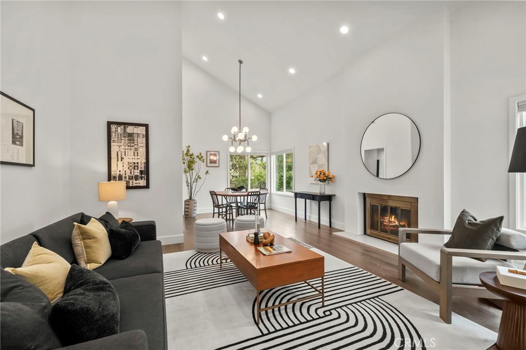 A rare gem in the heart of Woodbridge—modern luxury meets everyday comfort in this beautifully renovated detached home on a quiet North Lake cul-de-sac. Set apart by its private full driveway and attached two-car garage, this residence offers a level of convenience and privacy rarely found in the area. Thoughtfully redesigned in 2018 with high-end finishes then additions were made to create an additional suite style bathroom and many other detailed upgrades such as brand new paint and appliances. This home exudes sophistication from the moment you step inside. Crisp, smooth-finish walls and ceilings set the tone, complemented by wide-plank hardwood floors, recessed LED lighting, and dual-pane windows that invite natural light into every corner. A striking custom stainless-steel stair rail and designer shades elevate the space with understated elegance. The chef’s kitchen is open to the living area—perfect for entertaining—with quartz countertops, a farmhouse-style stainless steel sink, European cabinetry, and premium stainless appliances. Two walk-in pantries provide exceptional storage and convenience. Upstairs, the spacious primary suite is a true retreat, featuring a spa-inspired bath with dual vanities, a walk-in shower and soaking tub, and a generously sized walk-in closet. Major system upgrades, including a newer HVAC system and updated ductwork, ensure year-round comfort and efficiency. Outdoors, the newly hardscaped yard is a private escape , surrounded by mature trees and drought-tolerant gardens. A full sprinkler system with timer adds ease to low-maintenance living. Just steps from North Lake, scenic trails, lush parks, and award-winning schools, this home offers access to the exclusive resort-style amenities of the Woodbridge community—two lakes, beach clubs, pools, tennis courts, and more.
