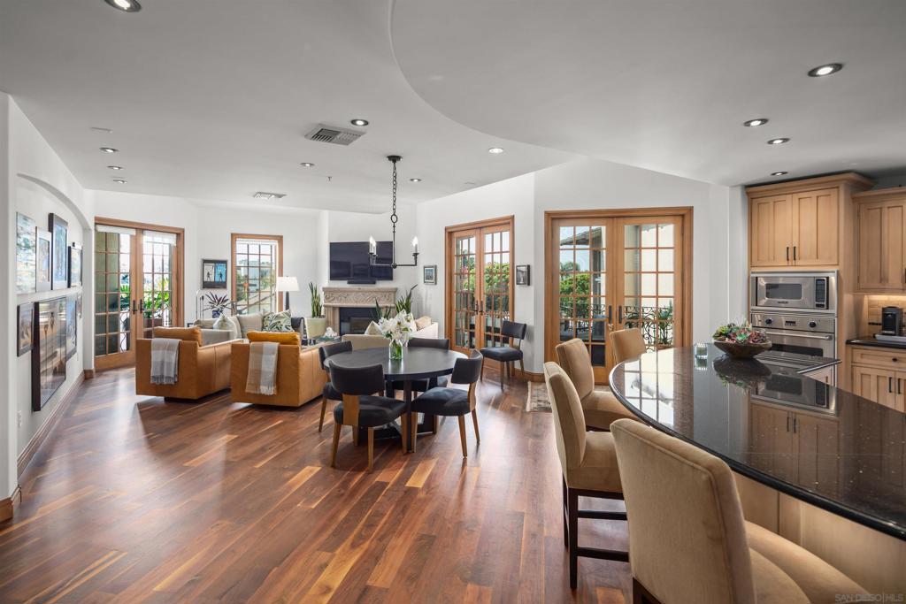 Introducing a stunning new listing at Regatta Bay! This remarkable corner penthouse unit has been exquisitely transformed into a spectacular coastal masterpiece , spanning approximately 2,325 square feet all on one level, showcasing exceptional quality and style. Every inch of this home is crafted with incredible construction and meticulous attention to detail, featuring newer top-of-the-line appliances, exquisite stonework and granite, beautiful hardwood floors, bespoke built-in cabinetry, and soaring vaulted ceilings. The interior is light-filled and airy, complemented by an inviting outdoor patio perfect for entertaining, complete with a BBQ bar and refreshing breezes. The expansive master suite boasts a brand new spa-like bathroom, while the gorgeous guest suite offers a perfect retreat for visitors. Additional features include an in-unit laundry room, two assigned parking spaces, and ample storage space. Regatta Bay is a sought after development nestled in the heart of Coronado, conveniently located within walking distance to the Bay, Ferry Landing shopping, an array of fantastic restaurants, and the charming ambiance that makes this area so special. Don't miss out on this extraordinary property!