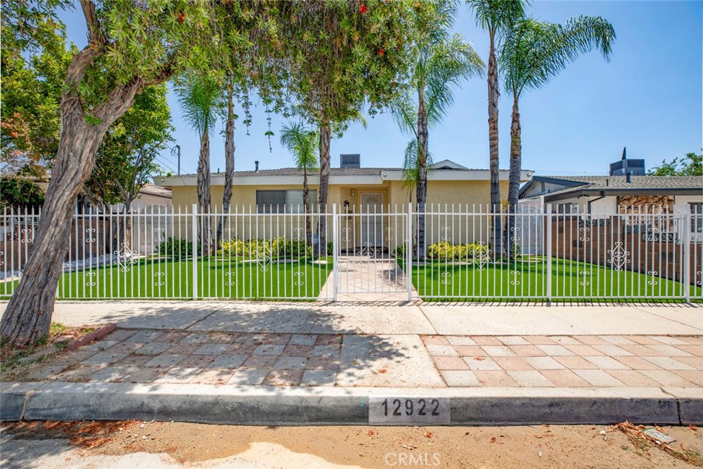 Welcome to your new home in North Hollywood, a charming 4 bed, 2 bath residence spanning 1752 square feet. As you step inside, the spacious living room greets you with its inviting atmosphere, illuminated by recessed lighting and dark hardwood floors. The kitchen is a culinary delight, featuring stainless steel appliances, ample cabinets for storage, and elegant granite countertops. Adjacent, the washer dryer hookups add convenience to your daily routines. Outside, the backyard beckons with a patio area ready for your outdoor furniture, perfect for relaxing or hosting gatherings. A designated barbeque area promises delightful meals under the California sun. Parking is a breeze with a 2-car garage, driveway and additional street parking available. Located near schools, restaurants, and stores, this home blends comfort and convenience seamlessly, making it a perfect choice for your next chapter.