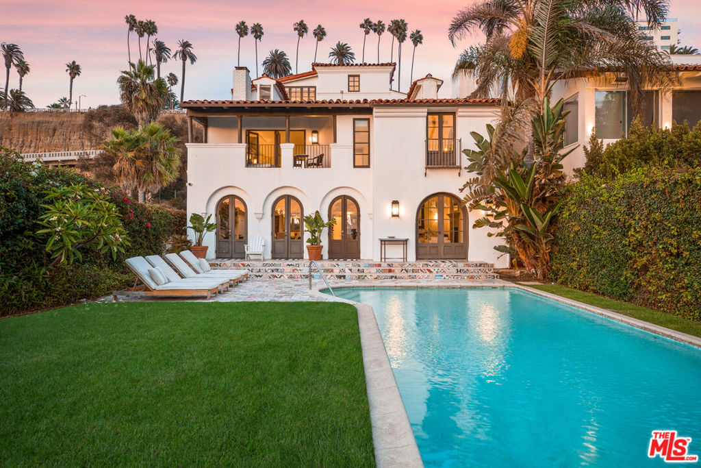 Introducing "Casa del Mar," a captivating Spanish-style beachfront residence in the heart of Santa Monica's coastal paradise. Designed by esteemed architect John Byers, this remarkable 7-bedroom home offers an elegant and timeless coastal charm. Set back from the street, the inviting courtyard leads you into this picturesque home where you are immediately greeted with an ocean view. Exposed beams, crown molding, and graceful French doors further accentuate the coastal allure. Spanning an impressive 6,485 square feet, Casa del Mar features two master suites on the water, each with a cozy fireplace and luxurious en suite bathrooms. The third level of the home hosts a spacious multipurpose room with a wet bar, providing immense space for entertainment and relaxation. Outside, an enchanting oasis awaits with a large ocean-side swimming pool for refreshing dips on sunny days. The inner courtyard, embellished with a Spanish tile fountain, offers a peaceful escape. This exceptional property boasts 45 feet of coveted beach frontage, providing unparalleled access to the coastline. Casa del Mar is a masterpiece of architectural brilliance and coastal allure. Embrace it's timeless charm and make it yours!