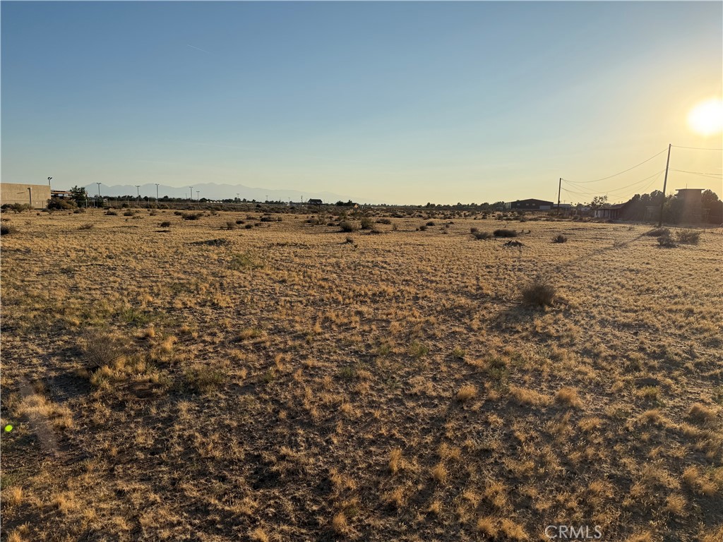 Level parcel, just shy of 10 acres. (9.98) Water, Power, Sewer, Gas all in the road on central. Can be purchased with the 9.97 acres to the north. Property is just North of the Apple Valley Senior Center. Can be used for Storage, warehousing, Etc. Zoned Commericial.