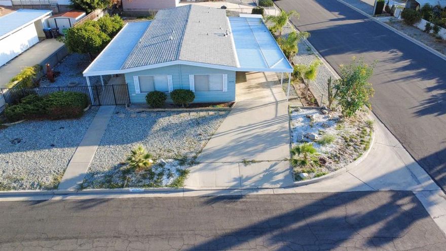 Welcome to 43745 Rassle Dr, Hemet – Your Next Chapter Awaits! Located in a peaceful 55+ community, this lovely 2-bedroom, 2-bath manufactured home sits on a large corner lot offering extra privacy and outdoor space. Step inside to a bright and open floor plan featuring a spacious living room, a well-equipped kitchen with plenty of storage, and comfortable bedrooms with ample natural light. Enjoy quiet mornings on the patio or evening walks through this friendly neighborhood. The oversized lot provides room for gardening, entertaining, or simply enjoying the fresh air. Conveniently close to shopping, dining, and medical facilities, this home combines comfort, convenience, and community living at its best.