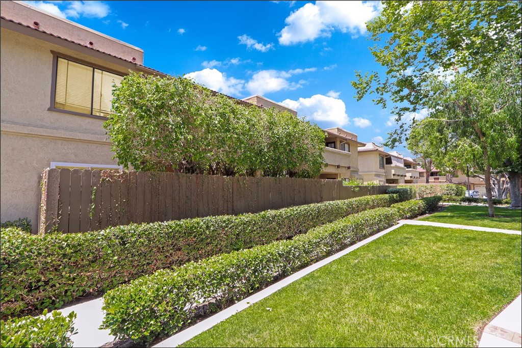 EXCEPTIONAL INTERIOR LOCATION WITH LARGE PATIO AND TOTALLY UPGRADED THROUGHOUT! Awesome end unit, inside location offering an amazing patio surrounded by lush greenbelts, mature trees and plenty of space for your outdoor enjoyment and entertainment. Open and airy floor plan offering a large living and dining room, upgraded dual glazed sliding doors leading to the large patio area. Stunning kitchen has been completely remodeled with designer Quartz countertops and waterfall feature, Farmhouse sink, stainless steel appliances, recessed lighting and bar seating. Large primary bedroom with walk-in closet and a totally remodeled primary bathroom with designer tub and shower surround, frameless glass enclosure and upgraded fixtures. Large second bedroom and a totally remodeled bathroom with large walk-in shower, frameless glass enclosure and upgraded fixtures. Upgraded dual glazed windows and sliding doors, upgraded HVAC, upgraded flooring and baseboards, custom plantation shutters and crown molding, textured ceilings, designer lighting fixtures and ceiling fans, custom closet organizers, upgraded interior doors and hardware and so much more! There is also an attached garage with direct access and a long driveway! Community pool and spa, walk to nearby park and recreation, excellent proximity to nearby shopping, Irvine Spectrum with restaurants, shops and entertainment and nearby hiking, biking and nature trails!
