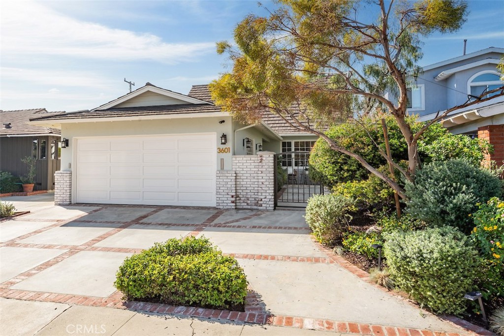 Beautifully updated and meticulously maintained, this gracious 5-bedroom, 3-bath home is nestled in the highly sought-after Tree Section of Manhattan Beach. Blending timeless charm with modern coastal style, the home features fresh interior paint, new flooring, plush new carpet, and abundant natural light throughout. The gourmet kitchen is a chef’s dream, boasting premium Wolf appliances, a walk-in pantry, and ample storage. Elegant bathrooms feature natural stone finishes including travertine, limestone, and marble, along with designer details throughout. The spacious primary suite offers a serene retreat with a private sundeck overlooking treetops and the landscaped yard. The flexible floor plan includes a convenient downstairs bedroom and bath—ideal for guests, a home office, or multi-generational living. Enjoy a low-maintenance turf backyard and professionally landscaped front yard with drought-tolerant California natives and a custom bronze entry gate. With its attached garage, 50-year metal shake roof, and prime location near award-winning schools, parks, beaches, and shopping, this home embodies the best of Manhattan Beach coastal living. Prime location near award-winning schools, parks, beaches and walking distance to dining and shops at both The Point and Manhattan Village. This home embodies the best of Manhattan Beach coastal living.