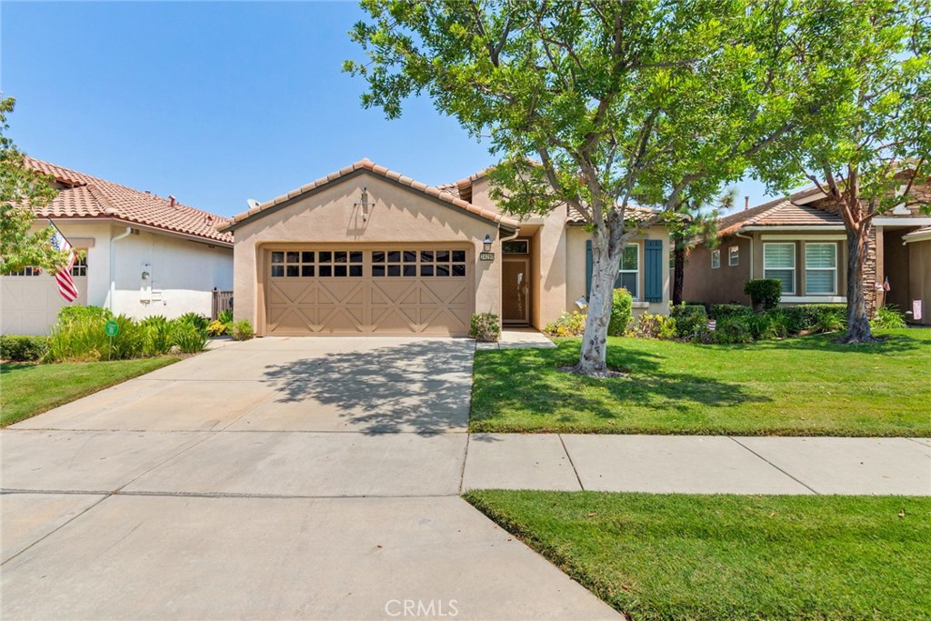 Welcome to Trilogy at Glen Ivy, a Delightful 55 and Better Gated Community Designed for Comfort and Connection. This Lovely Single-Story Home Offers an Open and Spacious Floor Plan Filled with Natural Light. The Kitchen Features Ample Cabinets and Counter Space along with All Essential Appliances: Stove, Microwave and Dishwasher. There is also a Laundry Room Conveniently Located Between the Kitchen and Garage. The Kitchen is Open to the Dining Area and Living Area for a Great Open Floor Plan. The Front Bedroom has Direct Access to the Hall Bathroom that has a Vanity with Storage and Tub/Shower Combo. The Primary Bedroom is Spacious with an Attached Bathroom with a Walk In Closet, Dual Sinks and Vanity with Storage, Shower and Privacy Toilet. The Backyard Features a Covered Alumawood Patio Surrounded by Mature Landscape and an Amazing View. Enjoy Low Cost Electricity with an Assumable Solar Lease, Plus a New HVAC System and a Whole House Fan that Make This Home Energy Efficient and Comfortable All Year Long. The Finished Two Car Garage Includes an Epoxy Floor for a More Finished Look. As a Resident of Trilogy, You'll have Access to a Championship Golf Course, Tennis Courts, Pickleball and Bocce Courts, a Fitness Center, Pools, Spa and a Wide Variety of Classes and Social Activities to Enjoy with Friends and Neighbors. Call today to Schedule Your Home Tour and Schedule a Tour with the Main Office for a Tour of the Grounds/Amenities. Enjoy All the Trilogy has to Offer!