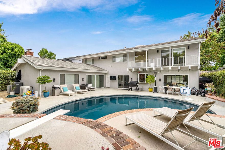 Prime Sherman Oaks 4 bedroom, 4 bathroom traditional home recently redone with a modern farmhouse style. This light and bright home is equipped with skylights, a formal living room, separate dining room off the Chef's kitchen with additional breakfast nook/pantry. The over-sized family room with vaulted ceilings boasts a separate wet bar perfect for entertaining or for family gatherings with sliders opening up to the grassy yard and sparkling pool. The downstairs en suite bedroom is perfect for guests and no detail was spared in the build out of closests. The over-sized master has 2 large walk in closests and a private balcony overlooking the pool. The other two bedrooms feature a shared jack and jill bathroom with marble shower and abundant closet space. This perfect bright traditional family home is now available in a coveted, quiet area of Sherman Oaks