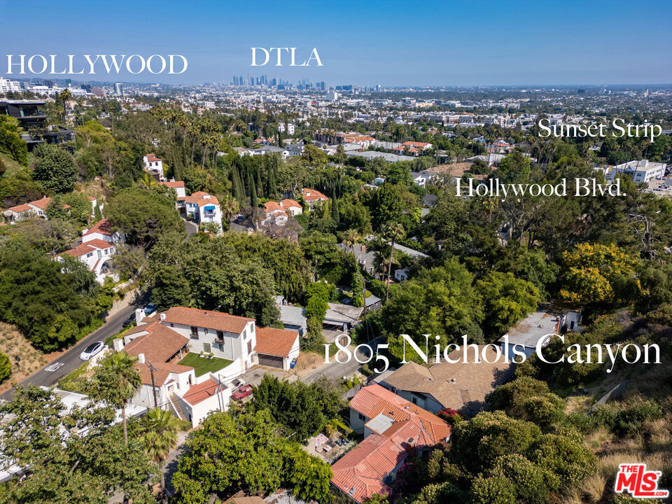 Newly remodeled lower Hollywood Hills ranch with indoor outdoor living and bonus guest house featuring separate kitchen and bathroom. The ultra private 3 bedroom 2 bathroom main house is situated on a flat lot perched above Nichols creek and surrounded by nature, yet you are just a few blacks from the Sunset Strip. The excellent floor plan features large scale rooms including a dramatic living room with vaulted ceilings and massive fireplace which leads to a large central dining room and chefs kitchen. There is a luxurious primary bedroom suite with new bathroom featuring two closets and direct access to a huge deck with views of the canyon. Tucked under the home is the newly remodeled guest house, gym or home office. Great outdoor living with grassy yard and patio in the front and patio with access to the hills in the rear. It is unbelievable to find such a natural setting so close to the Sunset Strip with living grassy front yard, deck and a large brick patio.