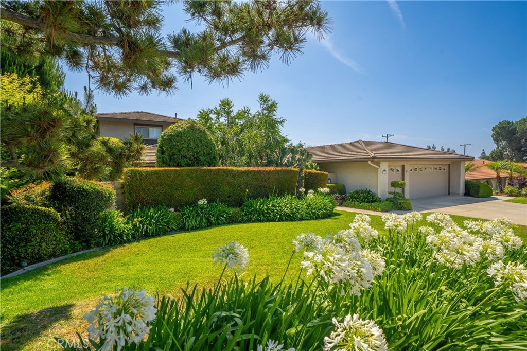 Nestled at the base of the Glendora foothills, this six bedroom three bathroom pool home is on the market for the first time in over four decades. Located in one of North Glendora’s most desirable neighborhoods, this spacious home is within walking distance to award-winning Glendora schools, hiking trails, and parks. Enter this beautiful home through double doors off the private courtyard. The large open living room has views to the courtyard, plantation shutters, and offers a perfect place for entertaining or relaxing with a book. The formal dining room has a sliding door with plantation shutters out to a large side patio that is ideal for private outdoor dining or summer entertaining. Adjacent to the dining room is the kitchen with custom oak cabinetry and Corian counters, breakfast area with sliding door to backyard, built-in desk space, and views to the backyard and the foothills. The breakfast area opens to an inviting family room with floor-to-ceiling brick fireplace, skylights for ample natural light, and vaulted, wood beamed, ceilings. Down the hallway is a full bathroom with dual sink vanity with quartz counters and custom oak cabinetry. The first of four bedrooms makes for a perfect office or study while another offers two closets and plenty of extra space. The third bedroom has a door into the master suite and makes for a perfect nursery. All three bedrooms have plantation shutters. The spacious master suite has a sliding door with shutters to the back patio and an ensuite ¾ bathroom with two closets. At the end of the hallway you’ll find a laundry room adjacent to the three car attached garage with a water softener and workbench. Upstairs you will find two very spacious bedrooms and a ¾ bathroom with their own HVAC system offering a retreat for guests, older children, or those seeking privacy. This wonderful home sits on a 12,170 sqft lot with a newly replastered pool and spa, lush grass and landscaping, and plenty of privacy. Upgrades include dual pane windows and sliding doors, a whole house fan, water softener, two HVAC systems, upgraded oak cabinetry, plantation shutters, and fire resistant concrete tile roof. This home is a true gem.