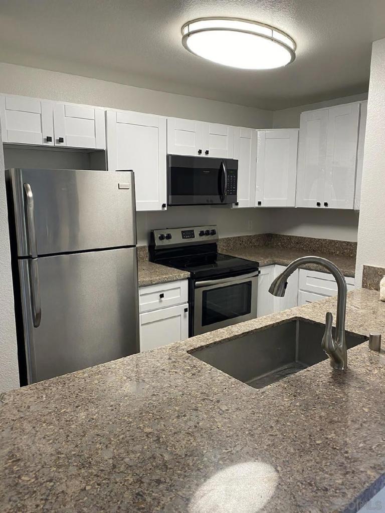 STRONG HOA FINANCIALS OVER 150%+ FUNDED, LOW HOA DUES NOT RAISED IN 18 YEARS, NO SPECIAL ASSESSMENT EVER, AND GREAT PROPERTY FACING DUE WEST! Come live your best life at Villa Vicenza where residents enjoy controlled access, friendly and professional on-site management, a sparkling heated swimming pool and spa, a professional well equipped fitness center, and a serene tropical courtyard! Completely remodeled in 2020! This ground level split dual master condominium features a neutral palette, luxury modern vinyl plank flooring throughout, an open floor plan with a large living room/dining room combo and an outdoor space, ideal for relaxing with a cup of coffee or a glass of wine. Perfect for full prep or a quick bite is the kitchen boasting new quartz countertops, stainless steel appliances, industrial sink/faucet, white cabinets, and new dual pane windows. The split master floor plan features quartz coutertops and new white vanities, tile surround bathtubs, nickel plated fixtures, low flow toilets and with walk-in closets in both bedrooms. A laundry closet with a new stackable washer & dryer combo is just off the kitchen for your convenience. This is a must see for owner occupancy or for a great investment rental in the UTC/LA JOLLA GOLDEN TRIANGLE OF SAN DIEGO. Close to the Ralphs shopping center filled with restaurants, shopping, banking, movie theater, and all your other local needs. Close to the world famous La Jolla Cove and La Jolla Shores and a short 10 minute trolly ride to the downtown Gaslamp District, this community and property has it all. Great opportunity to own in the popular Villa Vicenza community.