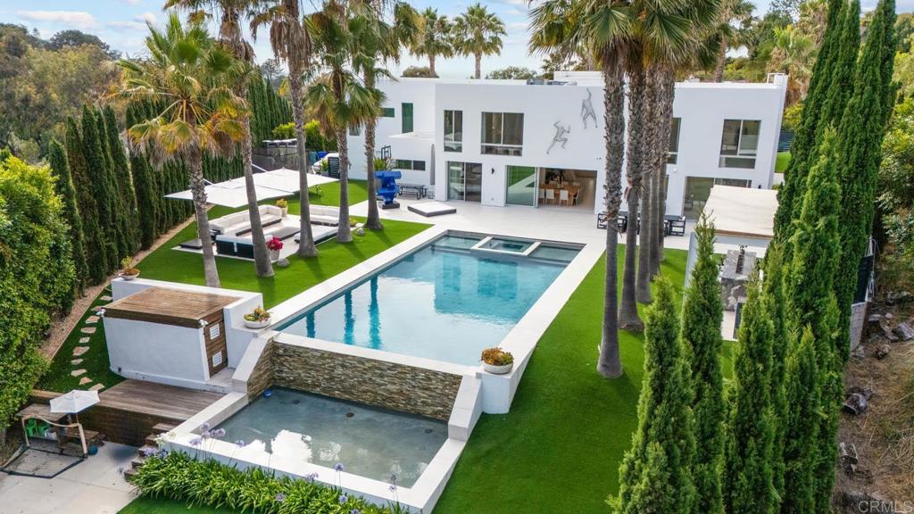 Elegant Coastal Living in La Jolla. Welcome to your dream home in one of California’s most iconic coastal communities. This beautifully remodeled residence in La Jolla offers the perfect blend of luxury, comfort, and lifestyle. Set on a beautiful landscaped lot, the home features an expansive pool, elegant outdoor spaces, and top-of-the-line finishes throughout. Inside, every detail has been thoughtfully upgraded, from the gourmet kitchen to the spa-inspired bathrooms. The master suite offers ocean view and a stunning closet. Just minutes from the beach and with easy freeway access, this location combines peace and privacy with convenience. Living in La Jolla means enjoying world-class dining, upscale boutiques, top-rated schools, vibrant art and culture, and endless outdoor activities—from surfing and kayaking to hiking along scenic coastal trails. This is more than just a home—it’s a lifestyle.