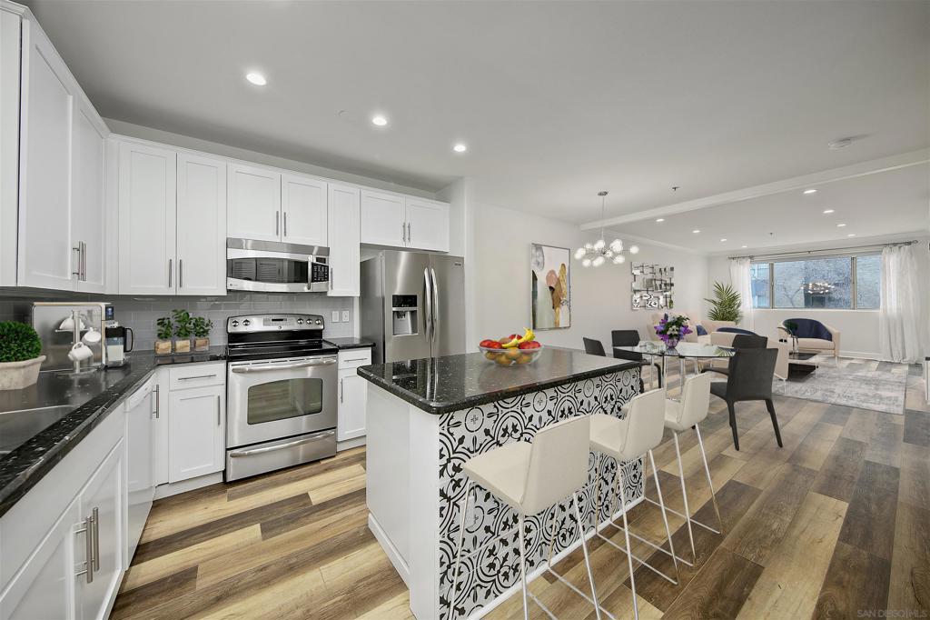 Beautifully remodeled spacious one bedroom in Little Italy's best location (on the 2nd level facing India St). A generous oversized covered balcony overlooks the beating heart of San Diego's hottest neighborhood. There's nothing for you to do but start enjoying life in this light filled, open design home. New flooring,stainless steel appliances, motorized shades & so much more. Beautiful master suite w/walk in closet. Clever coffee nook, stacked laundry, lots of storage. Don’t miss the fourth floor amenity deck with BBQ area and views of the bay and city. Condo comes with 1 parking space. Porto Siena is a welcoming complex with a BBQ, courtyard, and community rooftop area with gorgeous bay views. You will love all that Little Italy has to offer right out your door with wonderful restaurants & bars, shops, farmer’s market and close to the trolley /train.