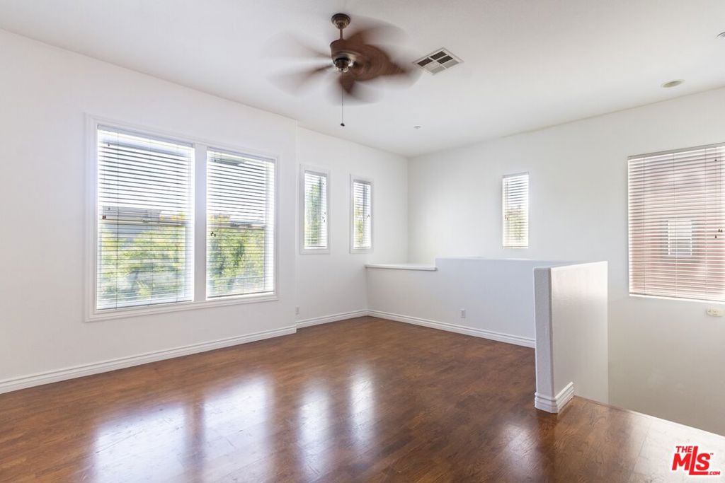 Amerige Heights home for rent! Charming end unit with 3 beds / 2 baths oriented towards the southwest of the building provides generous ample light to permeate the home throughout the day. High 10' ceilings add to the extra airy feel! The home features new paint throughout, luxurious hardwood flooring, classy wainscoted paneling, and tropical tiki-style ceiling fans and accents. The kitchen is outfitted with black granite tops, matching cute mini tiled backsplash, and a brand new Samsung gas range. Main bedroom with walk-in closet, 2nd bedroom has a sliding door that leads to a cozy balcony, and a 3rd bedroom with two large windows provide lots of light. This unit has an exclusive dumbwaiter elevator that helps to bring in groceries or goods from the ground floor to the living area. High speed fiber internet is included! Tandem parking garage has a NEMA 14-50 outlet for electric vehicle charging. Association pool, spa, tennis courts, and club house. Nearby schools are the award winning Robert C. Fisler School K-8 and Sunny Hills High School. Shopping, amenities, entertainment are all within close proximity to this area.
