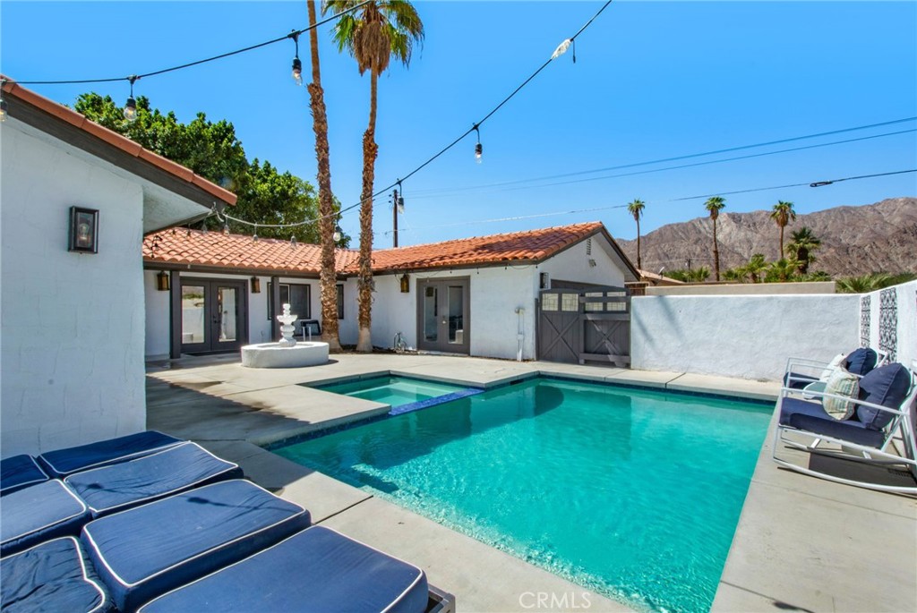 CHARMING CORNER LOT IN THE COVE – FULLY FURNISHED WITH POOL & MOUNTAIN VIEWS!
3BD/2BA home on a desirable corner lot in La Quinta Cove. Fully furnished with stainless steel appliances, washer/dryer, and stylish finishes throughout. Open-concept layout features a sunken living room with wood-burning fireplace and wine cooler. Kitchen boasts quartz countertops, center island, and modern cabinetry. All bedrooms have walk-in closets and laminate tile flooring. Primary suite includes en suite bath and French doors opening to a private courtyard with new sparkling pool, spa, and water fountain—perfect for enjoying panoramic mountain views. Includes attached 2-car garage. Close to Old Town La Quinta, golf, hiking, and more. Ideal as a full-time residence, vacation home, or investment property!