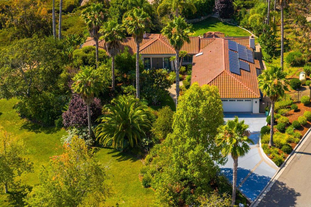 Beautifully updated single story home in the desirable Rancho Encinitas neighborhood. Totally usable one acre lot with tons of privacy and a very peaceful setting! Elevated upper lot with room for pool, ADU(s), pickle ball court, grape vines or a large playground….so many possibilities. Impeccably maintained, true single story home with no interior steps and wide hallways which lends itself to multi-generational living. Separate, private primary suite with gorgeous bath, separate vanity and newly remodeled oversized walk-in closet. Open living room with fireplace and dining room with pass through to kitchen. Newly updated kitchen which opens to family room with fireplace. Breakfast nook off kitchen with tons of natural light. Two bedrooms in one wing that can be closed off for young adults or in-laws. Fourth bedroom has no closet and is built out as an office with it's own entry, but could be converted back to a bedroom. Most of the home and finishes have been updated within the past few years, including: owned solar with Tesla Powerwall, new heating & A/C units, new tankless water heater, washer/dryer, high quality kitchen appliances, new bath and laundry room, security system w/cameras, outdoor lighting and more. Spacious 3 car garage with ample storage. Rancho Encinitas is a beautiful custom home neighborhood with one acre lots and has a country feel, yet close to all three schools, shopping, restaurants and beaches. The best of both worlds! Olivenhain Pioneer Elementary. No HOA or Mello-Roos