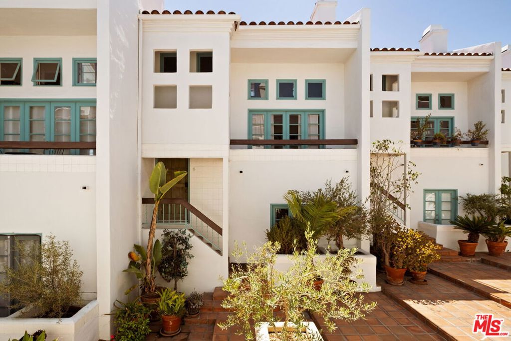 Behind the gates of an elegant Mediterranean boutique building, this sophisticated, sun-drenched townhome offers an ideal balance of style, privacy, and indoor-outdoor living all in one of West Hollywood's most desirable pockets. The spacious, open-concept layout is enhanced by an abundance of natural light, while soaring ceilings and thoughtful finishes create an airy elegance throughout. Featuring 2 bedrooms and 3 bathrooms, the home includes a private, direct-access 2-car garage, laundry room, expansive terraces perfect for entertaining, and a stunning rooftop deck with sweeping city views a tranquil retreat above it all. Experience the best of West Hollywood living in a boutique setting, just moments from Melrose, Sunset, and the area's most iconic shops and restaurants.