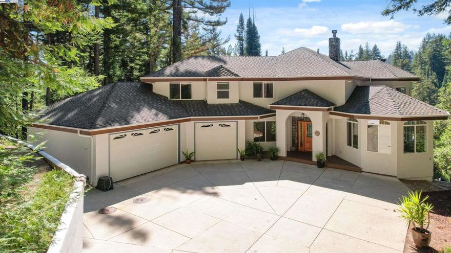 Enjoy the best of both worlds, just a short commute to the innovation of Silicon Valley and minutes from the coastal beauty of Santa Cruz, yet worlds away in your own redwood retreat. Welcome to 716 Dry Well Road, where luxury, serenity, and convenience come together on 3.5 acres of pristine forest. Built in 2000, this elegant 4 bed/2.5 bath home was designed with modern living in mind. Expansive windows bathe the home in natural light, offering panoramic views of redwoods and mountain ridges—an inspiring backdrop whether you’re working from home, hosting guests, or relaxing. The open-concept kitchen is a chef’s dream, featuring granite countertops, abundant storage, and spacious pantry, all while framing stunning views. The luxurious primary suite is a sanctuary, with a spa-inspired ensuite, dual vanities, generous closet, private sunken, and deck. Enjoy excellent indoor-outdoor living with a large, south-facing deck perfect for entertaining, morning coffee, or unwinding among birdsong and fresh mountain air. A substantial 3.5-car garage provides not only ample parking but also extensive built-in storage and workspace—ideal for today’s active, multi-faceted lifestyle.