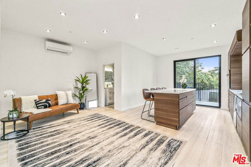 Discover 2315 and 2315 1/2 Loma Vista Place: An urban oasis nestled among treetops on a historic stair street in the vibrant, artistic enclave of Silver Lake. Built in 2024, this brand-new, two-bedroom, two-bath single-family residence radiates contemporary style in a natural setting. The first level welcomes you with an entryway leading to an open-concept living room that boasts a custom kitchen. This kitchen is equipped with modern appliances and features a stunning Calacatta Gold Quartz island that seats four. Completing the first floor is a full bathroom and sliding glass doors that open to a wraparound deck, perfect for embracing indoor-outdoor living. Upstairs, you'll find an additional den space, two bedrooms, and a luxurious bathroom with a porcelain tile shower adorned with sleek gold finishes, offering a perfect fusion of style and functionality. The location provides a rare tranquil setting among treetops, with views of the San Gabriel Mountains. The private wraparound deck is an ideal space for outdoor dining, gardening, and socializing, epitomizing the California lifestyle. An attached studio ADU, with a full bath and its own address, adds versatility. Whether used for rental income or as a dedicated home office, this space also includes its own garden area and a balcony that frames breathtaking panoramas of Silver Lake and downtown Los Angeles. Situated on a serene stair street, this residence is perfect for those who value privacy, nature, and an active lifestyle. It beautifully marries sophisticated design with practical living, right in the heart of Silver Lake, one of the most sought out neighborhoods in all of Los Angeles. Only street parking, the property is located on the historic stair street.