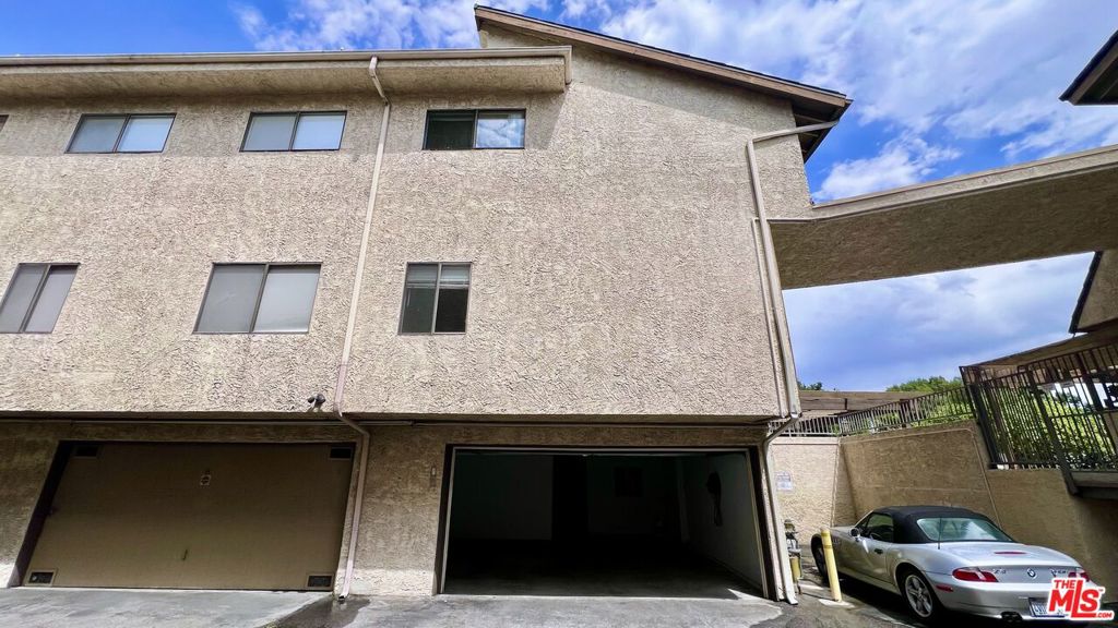 Welcome to this freshly painted, move-in ready townhouse featuring 3 bedrooms and 3 bathrooms across three levels of spacious, comfortable living. The main floor includes a living room with fireplace and balcony, a versatile bonus room, a guest bathroom, and an updated kitchen with plenty of cabinetry, modern finishes, and a large dining areaperfect for everyday meals or entertaining. Upstairs, two of the three bedrooms offer vaulted ceilings and generous closet space, accompanied by two full bathrooms. The lowest floor features a two-car garage, laundry with washer and dryer, and an additional bonus room for flexible use. Situated at the back of the community for maximum privacy, the home is surrounded by greenery and adjacent to a beautifully landscaped park with a picnic area, creating a serene, retreat-like feel. Residents enjoy a nearby community pool (heated year-round), spa, and sauna. Conveniently located near shopping, dining, and transportation, this home offers low-maintenance, easy-living at its best. Don't waitschedule your tour and move in today!