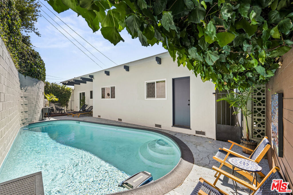 Finally the Los Feliz Home you have been waiting for with Pool and Views and under $2.9M! Beautifully set in the Hills above Sunset Blvd, Hyperion and Commenwealth with panoramic views of City Lights and Hills including the iconic Griffith Park Observatory and more. Enter your home from your dramatic double door entry or secure 2 car attached garage to the entrance entertainment floor with bar, gaming areas, plenty of areas for your guests to lounge a 3/4 bathroom and extra den/office. One level up you will find a large and extremely usable Living Room Area, dinning room and open kitchen with adjacent balcony, all looking out to the explosive views. Also on the upper level are the Primary bedroom with access to the backyard where the sparkling pool awaits your daily plunge, 2 guest bedrooms and Guest Bathroom. New roof installed recently, exterior and interior painting and many more upgrades throughout!