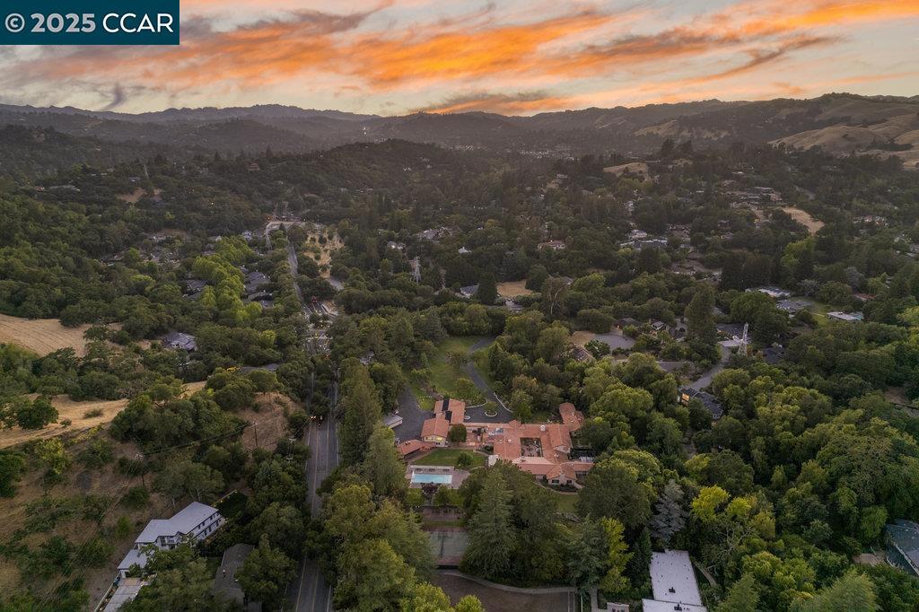 A Once-in-a-Lifetime Offering: The Former Kaiser Estate — Set on 7.14 completely flat acres in the heart of Lafayette, this extraordinary estate represents one of the most significant and versatile properties ever to come to market in the East Bay. Formerly known as the Kaiser Estate, the property boasts a 14,000± sq. ft. residence with grand scale, timeless architecture, and a commanding presence. What truly sets this estate apart is its R20 zoning, making it not only a remarkable legacy residence but also an incredible development opportunity. With expansive, usable land and prime Lafayette location, the property provides a rare chance to create exclusive estate lots or a visionary compound that few could ever replicate. Opportunities of this scale and versatility are virtually nonexistent in today’s market. Whether reimagined as a private family estate, subdivided into a luxury enclave, or developed into multiple custom homes, 940 Reliez Station stands as a blank canvas for the next chapter of East Bay luxury living.