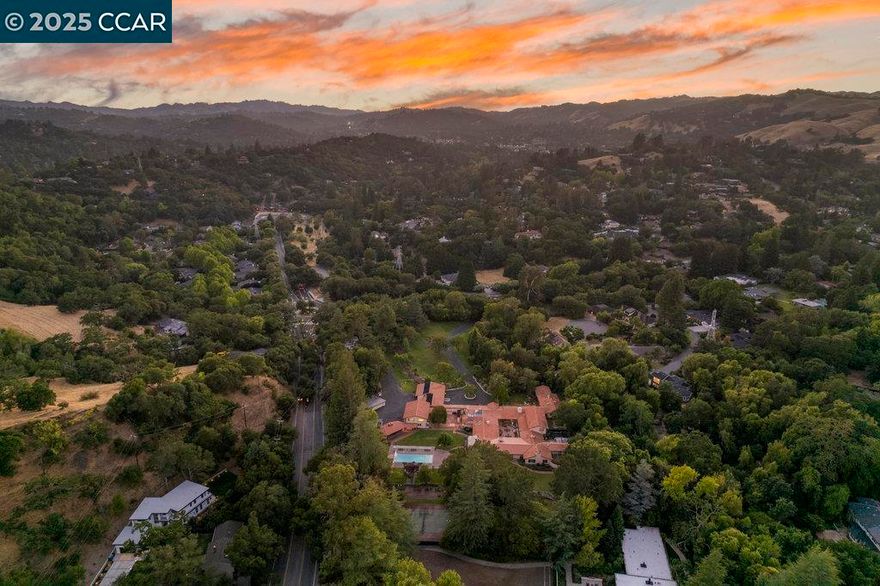 A Once-in-a-Lifetime Offering: The Former Kaiser Estate — Set on 7.14 completely flat acres in the heart of Lafayette, this extraordinary estate represents one of the most significant and versatile properties ever to come to market in the East Bay. Formerly known as the Kaiser Estate, the property boasts a 14,000± sq. ft. residence with grand scale, timeless architecture, and a commanding presence.  What truly sets this estate apart is its R20 zoning, making it not only a remarkable legacy residence but also an incredible development opportunity. With expansive, usable land and prime Lafayette location, the property provides a rare chance to create exclusive estate lots or a visionary compound that few could ever replicate.  Opportunities of this scale and versatility are virtually nonexistent in today’s market. Whether reimagined as a private family estate, subdivided into a luxury enclave, or developed into multiple custom homes, 940 Reliez Station stands as a blank canvas for the next chapter of East Bay luxury living.