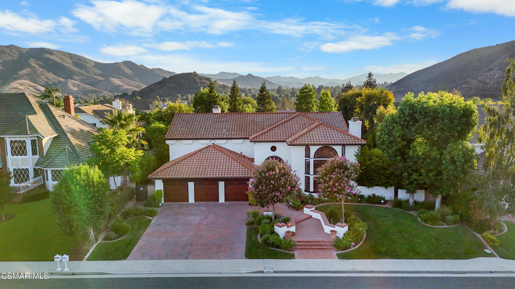 Welcome to 29340 Castlehill Drive, where elegance meets enchantment in the prestigious Morrison Highlands. This breathtaking 5-bedroom, 5-bathroom estate spans nearly 5,000 square feet of open living space bathed in natural light and has been beautifully reimagined with attention to every detail.Step inside to soaring ceilings and a graceful flow that draws you into the heart of the home. The formal living room, filled with sunshine, opens to a sophisticated dining room, ideal for hosting both lively gatherings and intimate dinners. Just beyond, the family room offers warmth and comfort with its inviting fireplace, custom built-ins, and wet bar, while walls of windows frame views of the backyard.The kitchen is a showpiece for any cook, with professional-grade Viking appliances, a Franke farmhouse sink, striking Calacatta Laza quartz counters, and generous workspace. A casual dining area and seamless connection to the family room make it the perfect everyday hub. On this level, you will also find two private en-suite bedrooms, each with tastefully remodeled baths, ideal for guests or multi-generational living.Upstairs, a light-filled family lounge welcomes you with a dry bar, beverage center, and ample storage, a perfect space for game nights, weekend movies, or simply unwinding with good company. Two large secondary bedrooms are served by a beautifully updated bath, while the primary suite offers an indulgent retreat. A separate sitting room with a double-sided fireplace creates a cozy escape or private workspace, and two spacious walk-in closets lead to a luxurious spa-like bathroom.Through charming French doors, the backyard feels like your own private resort. Set on a third of an acre, this personal haven features a sparkling pool and spa surrounded by generous lawn space and room to play. The built-in BBQ, covered patio, and multiple sitting areas make it easy to entertain or simply enjoy a quiet afternoon outdoors.Throughout the home, you will find thoughtful custom touches, from chair rail and refined moldings to designer fixtures that add character and warmth. Recent updates include new hardwood floors, custom window treatments, designer light fixtures, a tankless water heater, newer HVAC units, pool heater, and filter, along with remote-controlled shades, smart dimmers, and LED lighting.Located in one of Agoura Hills' most desirable neighborhoods, this home offers not just beauty but also convenience, with close proximity to award-winning schools, charming dining, scenic hiking trails, and the Pacific Ocean.