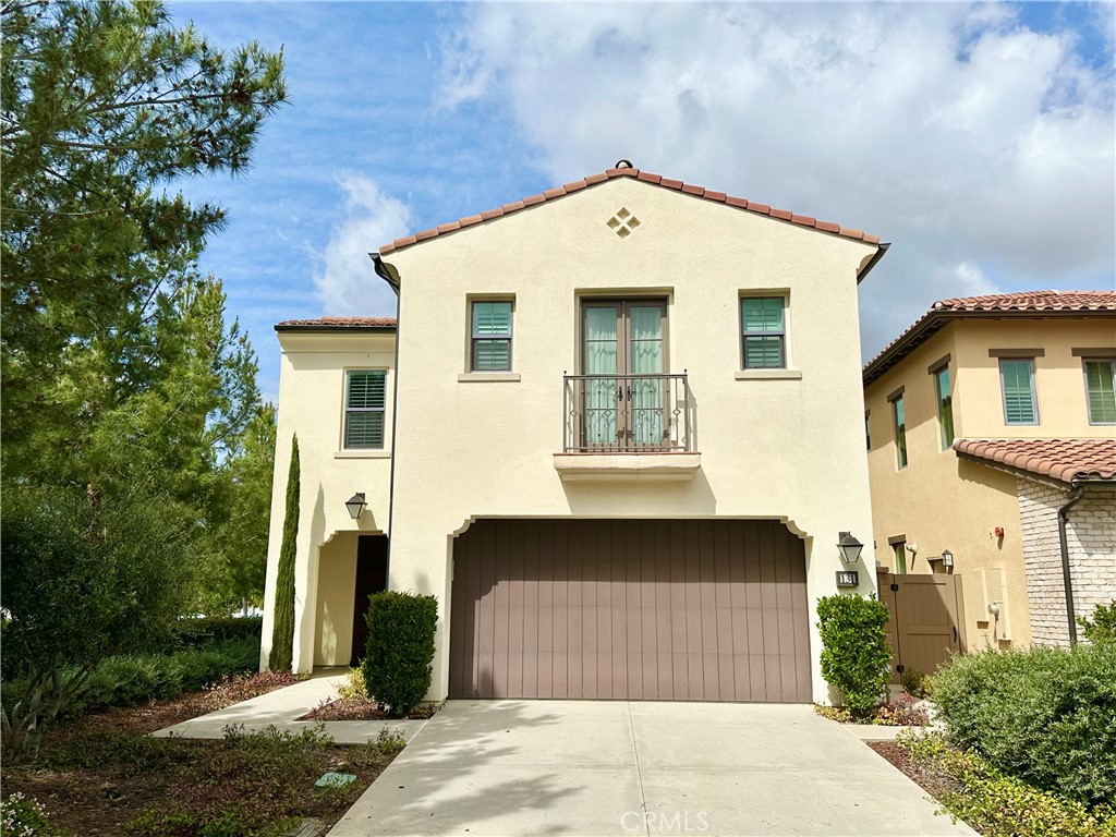 This stunning corner-lot home in the heart of the community offers the perfect blend of modern design and energy efficiency. With fully paid-off solar panels and a Tesla Powerwall, enjoy little to no electricity costs. Ideally located within walking distance to the elementary school, this home features an open-concept Great Room, a main-floor bedroom with a full bath, and a versatile upstairs loft. The upgraded kitchen is a chef’s dream, boasting gorgeous quartz countertops, an induction cooktop, a full subway tile backsplash, and a spacious center island with bar seating. The adjacent dining and living areas flow seamlessly into the covered California Room, perfect for indoor-outdoor living. Upstairs, the primary suite includes a luxurious spa-like bath with a soaking tub, a separate shower, and a walk-in closet. Two additional bedrooms each have en suite bathrooms, and the convenient upstairs laundry room completes the space. Additional highlights include designer light fixtures, LVP flooring on the main level, plantation shutters, and recessed lighting. Enjoy resort-style amenities, including pools, a spa, tennis courts, parks, and more. With nearby shopping, dining, and top-rated Irvine schools, this home offers the best of Eastwood living!