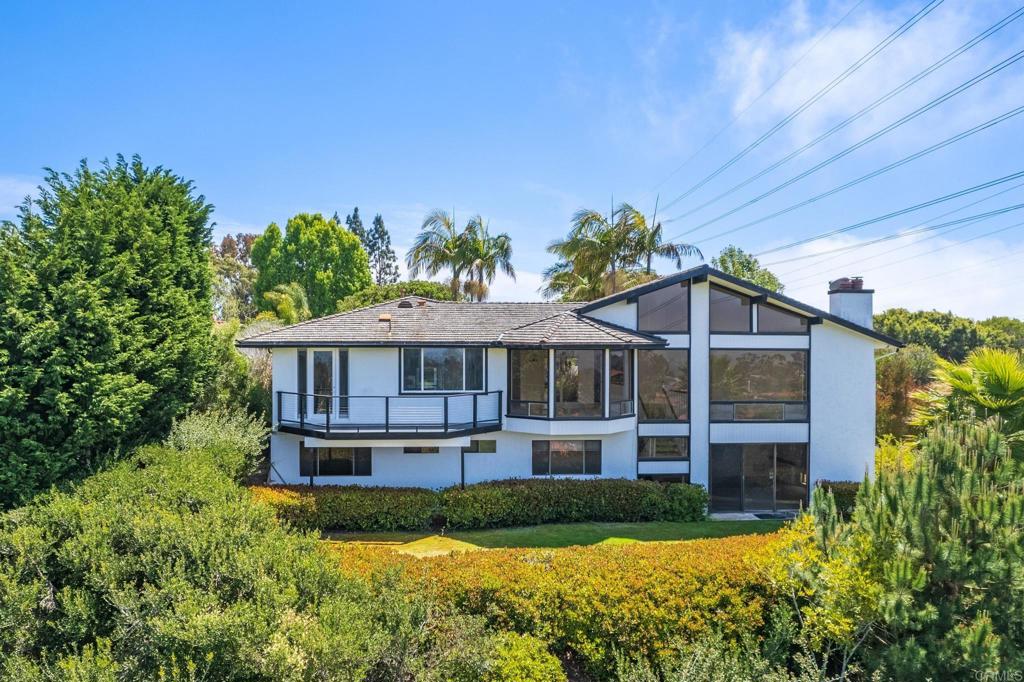 Situated on one of the most coveted streets in Solana Beach with beautoful views of the Lomas Sante Fe Golf Course and Country Club. Floor to ceiling Mid-Century inspired design windows looking down on the magnificent greens of the Golf Course. Lots of natural light in this two story home with a sizable backyard large enough to build an infinity pool overlooking the golf course. Master bedroom is on main level along with an additional bedroom and casita. Two additional bedrooms are located downstairs with a large entertainment second living area. **NOTE** The house is under construction being fully renovated. The house is approximately 70% completed with an estimated completion of August 2025.