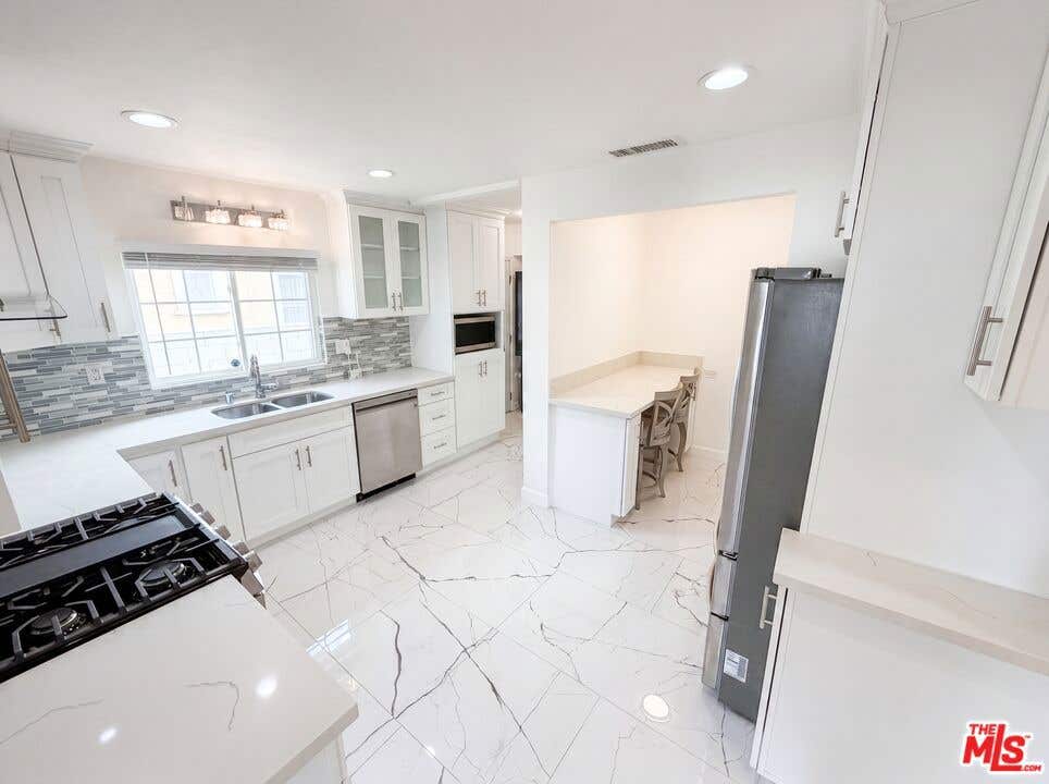 Photo of 6303 Eileen Avenue, Los Angeles, CA 90043 (MLS # 26841309)