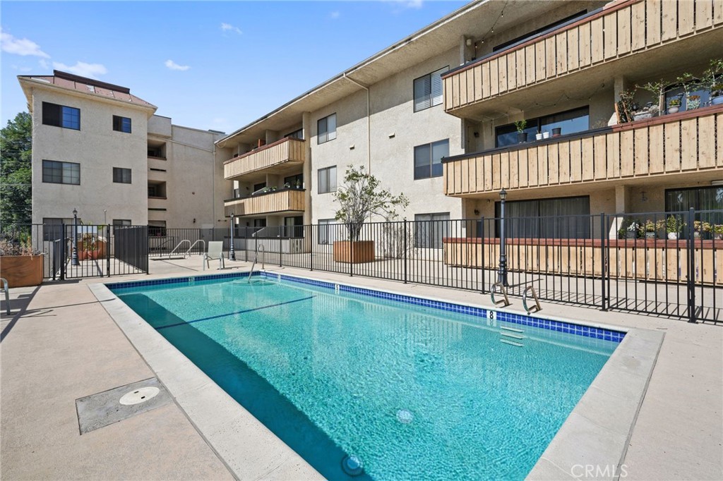 Beautifully remodeled condominium in the highly desirable Nordhoff Terrace complex. Features include 2 bedrooms and 2 updated baths, huge living room, updated chef's kitchen with quartz counters and stainless steel appliances, laminate flooring and recessed lighting throughout, large primary room offers a walk-in closet with custom built-ins and en-suite primary bath. Step outside onto your covered patio with new tile floors where you can enjoy views of the community pool & spa. Conveniently located just minutes to the Northridge Mall, Costco, CSUN and wide variety of dining and shopping options. Additional amenities include a controlled entrance to the building, a convenient elevator, in-unit washer & dryer hook-ups and so much more.