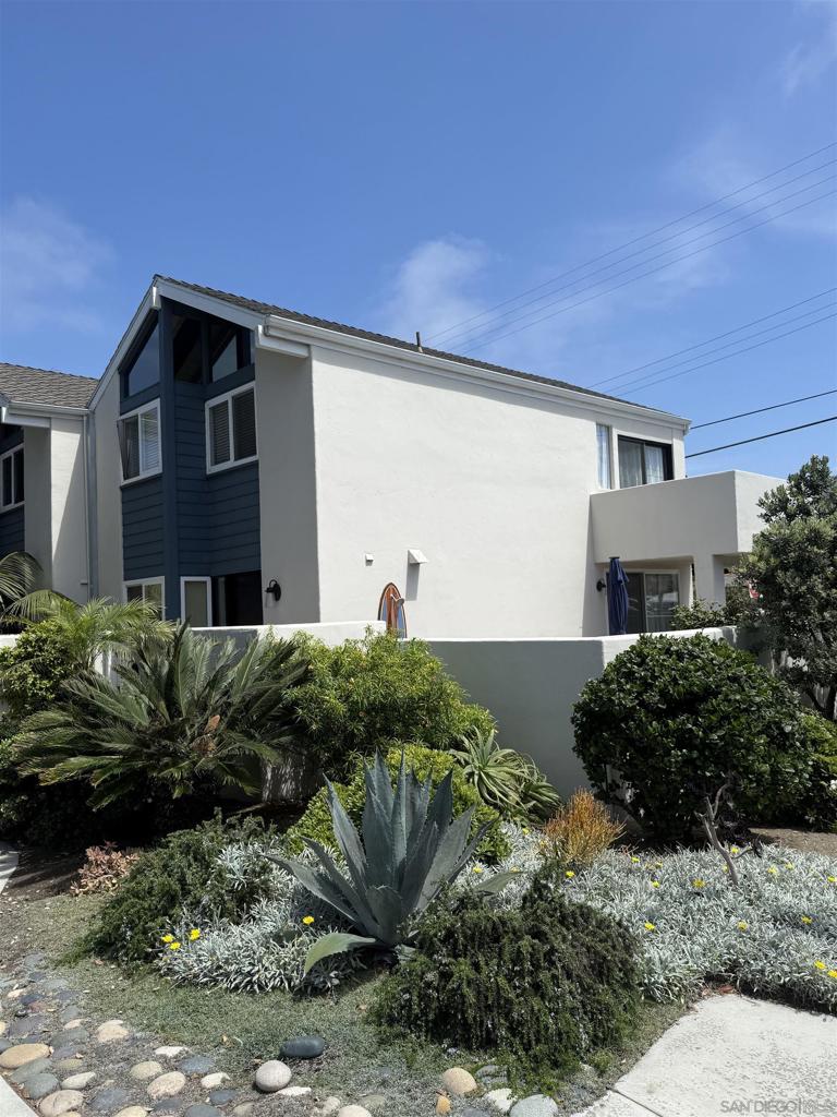Furnished Luxurious Beach Colony Townhome, offers 2 bedrooms and 2.5 bathrooms with 1,200 sq ft of living space. Recently remodeled very high end. Also it features AC, Laundry room, a private yard ideal for entertaining and a balcony with partial ocean views. The unit includes a one-car garage and an additional parking spot. Located just steps from the Sand!
