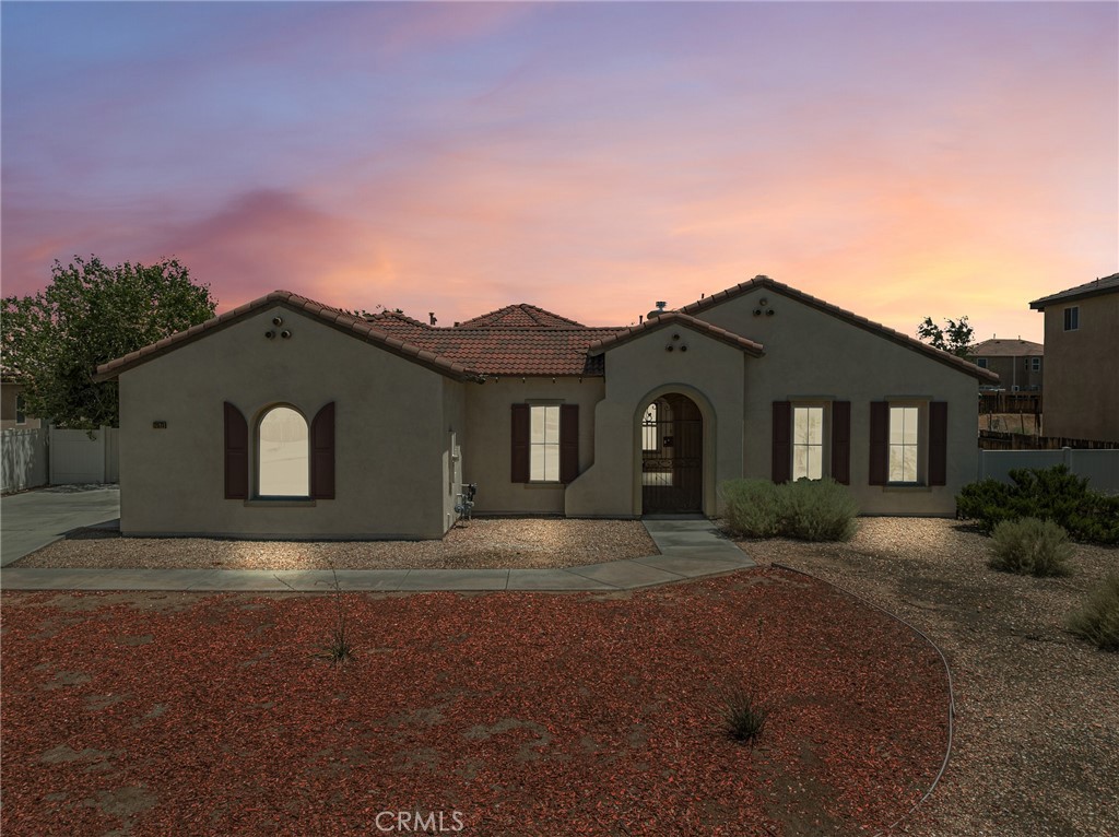 Situated within the picturesque community of Apple Valley, this exquisite residence comprises four generously sized bedrooms and three elegantly appointed bathrooms, rendering it an ideal choice for families or individuals seeking additional living space. The interior design features an open floor plan, facilitating seamless connectivity between the living areas, which is particularly suitable for entertaining or cherishing family moments. The property is enhanced by a spacious three-car garage, providing ample storage and parking capacity. Encompassing a generous lot, the residence offers ample outdoor space for relaxation and recreation. There is an attached Casita with its own bathroom and closet. The location is conveniently situated, offering easy access to local amenities, parks, and shopping establishments, ensuring that all necessary conveniences are within a short driving distance. This residence embodies the harmonious fusion of comfort, style, and convenience, nestled within the heart of Apple Valley.