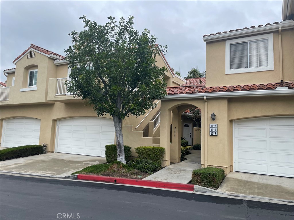 Turnkey, upgraded, and perfectly located in the gated Estancia community of Tustin Ranch, this single-level carriage-style home offers the perfect blend of comfort, style, and convenience. With no one above or below, you’ll enjoy ultimate privacy in a bright and airy layout featuring vaulted ceilings and abundant natural light.
Step inside to luxury vinyl plank flooring and upgraded baseboards throughout—no carpet anywhere—plus fresh designer paint that enhances the open floor plan. The spacious living room is centered around a cozy gas fireplace and opens to one of two private balconies, ideal for morning coffee or evening relaxation.
The updated kitchen includes stainless steel appliances (stove, oven, microwave, dishwasher, refrigerator, recessed LED lighting, and generous storage including a pantry. The large primary suite offers two closets—both upgraded with shelving and the larger one has new triple track mirrored doors—a private balcony, and an en-suite bath. The secondary bedroom is perfect for guests or a home office.
Additional upgrades include energy-efficient, dual-pane sliding doors and guest room window, a new furnace, recessed lighting throughout, and an inside laundry area with washer and dryer included.
The oversized two-car garage is located just steps from the front door.
Community amenities include a sparkling pool, spa, and beautifully maintained grounds. The home is ideally located across from Heritage Park, close to shopping, dining, The Tustin Marketplace, and easy freeway access all within the excellent Tustin Ranch school district. Features You’ll Love:
No one above or below, vaulted ceilings & abundant natural light, new luxury vinyl plank flooring throughout, two private balconies, updated kitchen with stainless appliances, primary suite with upgraded closets & balcony, new furnace & recessed LED lighting. Be sure to put this one at the top of your list. It won't last long.