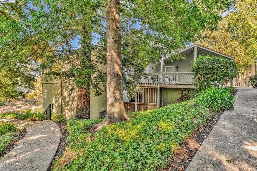 Welcome to 394 Camelback Road, a beautifully updated end-unit townhome offering THE BEST LOCATION in Pleasant Hill’s sought-after Tres Lagos community. Perfectly positioned overlooking a tranquil lago (lake) w/fountain, this home offers a rare blend of modern comfort & peaceful surroundings. Inside, enjoy 4 bedrooms (including one on main floor with 1/2 bath), granite countertops, white cabinetry, hardwood flooring, recessed lighting, fresh paint throughout & new carpets in bedrooms. Spacious living room features vaulted ceilings & cozy brick gas fireplace, while French doors open to 1 of 3 private decks nestled beneath lush redwoods—perfect for entertaining or relaxing. The primary suite offers privacy w/views, a walk-in closet & spa-like bath w/stall shower & dual sinks. Community amenities include: sparkling pool, clubhouse, tennis/pickleball courts as well as lush, beautiful grounds & walking paths that circle 3 interconnected lakes complete w/fountains, fish, turtles & birds. Conveniently close to shopping, dining, DVC, BART, trails & freeways. Includes attached garage + carport, in-unit laundry. HOA covering water, exterior, roof & landscaping. Enjoy serene views from nearly every room—a rare move-in-ready retreat in the heart of Pleasant Hill. OH 11/2 1:30-4