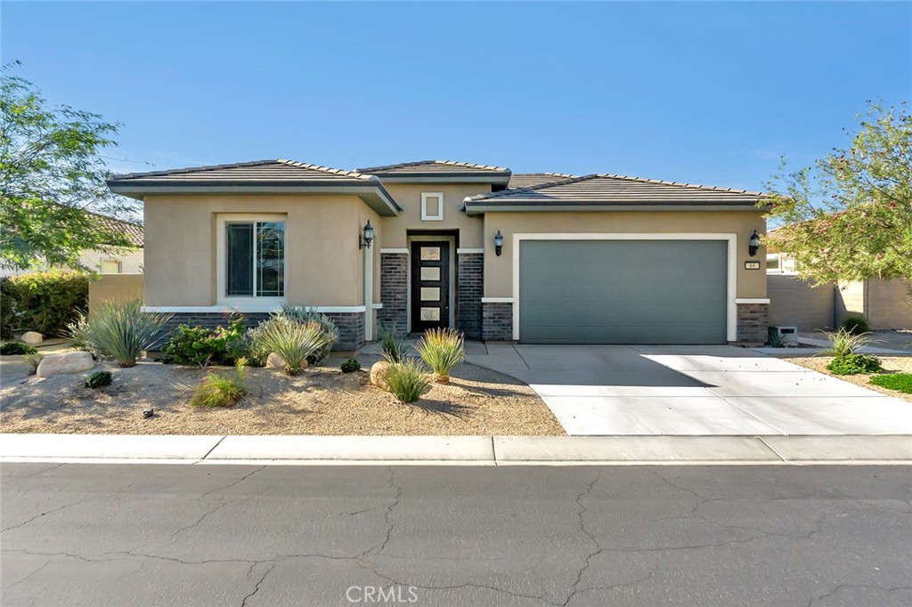 Welcome this Charming Home in the prestigious 55+ Del Webb Rancho Mirage Community!! This coveted popular Spanish Inspired Haven Plan offers 2 Bedrooms, 2 bathrooms, large flex room and high 10 foot ceilings. It features an open floor plan, large master bedroom with huge walk in closet, chef kitchen with expansive kitchen island, stainless kitchen appliances, walk in Pantry, center court yard adjacent to the kitchen, laundry room with sink, living room opens to the cozy covered patio, low maintenance backyard with artificial turf, spacious side yard/patio and golf cart garage. This is located close to top ranked Eisenhower Hospital and medical services, centrally located in Coachella Valley near Palm Springs, near golf courses, shopping and entertainment. Del Webb Community offers a world class lifestyle with numerous amenities such as state-of-the-art clubhouse, fitness center, pickleball, tennis courts, resort style pool and spa! Must see, priced to sell fast!!
