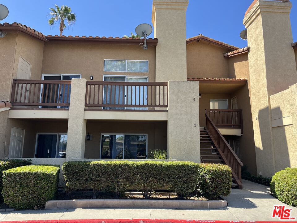 Come home to this amazing upper level condo nestled in the rear of this very well maintained complex. This unit is in a key location away from the street with quiet serenity. The complex is extremely well maintained with an incredible pool and spa. You'll always have something to do when your new home is so convenient to so many amazing attractions like award winning schools, hiking, parks, restaurants, and tons of shopping. On those hot summer days and nights enjoy swimming in the resort style pool just a few steps from your front door. When it's time to unwind in your amazingly bright and airy new home, you'll feel right at home relaxing in the large open vaulted living room next to the fireplace. Enjoy the fresh air when opening any of the huge patio doors and windows throughout the unit. The home boasts laundry in the unit which is always a huge bonus. Your dedicated parking is covered and just steps to your door and patio. In regards to a patio, this unit has a great large patio ready to create your own outdoor sanctuary. This great home is perfect for a young professional or couple ready to put their own TLC and design into this unit. Get it while you can because at this price it won't last!