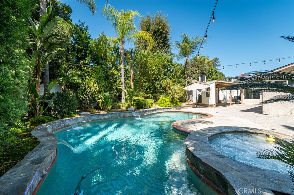 Welcome to your absolutely turn key, bright 4bed/3full bath, pool house with 1,656 sqft practical floor plan. The skylight in the kitchen makes you feel you're cooking outdoors. The completely flat and nicely paved backyard is a safe heaven to enjoy the pool while having room for numerous sitting areas and access to the living room and two primary bedrooms and bathrooms. This is not a flip. Sellers lived in it for five years and used the best material for flooring, new windows, new roof, outdoor pavers, Kitchen, garage, pool, storage, greenhouse, and many more. Pictures and videos don't do justice. You have to see it in person. For your convenience, there is a EV charger in the garage, and all the A/C, pool &spa system are connected to your phone.