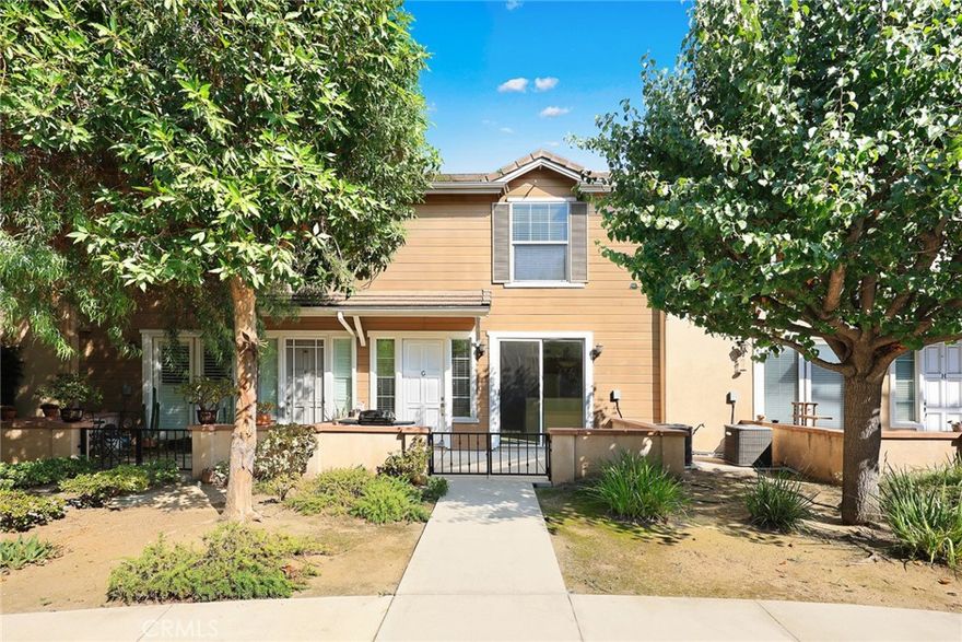Welcome to this stunning townhome located in a desirable gated community in Azusa. Built in 2007, this contemporary two-story residence offers 3 bedrooms, 2.5 bathrooms, a spacious loft, and an attached 2-car garage. The inviting front porch creates a welcoming entrance. Step inside to find an open first-floor layout featuring a bright living room with a cozy fireplace, an elegant kitchen with granite countertops, wooden cabinetry, and a breakfast bar, and a dining area perfect for gatherings. Upstairs, a versatile loft provides space for a home office, exercise area, or entertainment. The primary suite boasts high ceilings, a walk-in closet with built-in organizers, and a spa-like bathroom with dual sinks, a soaking tub, and a separate walk-in shower. Two additional generously sized bedrooms with mirrored closets complete the upper level. Additional highlights include tile flooring on the first floor, wood flooring upstairs, crown moldings, neutral paint colors, and storage racks in the garage with washer/dryer hookups.

Conveniently situated near the 605, 10, 210, and 57 freeways, this home is just minutes from Downtown Azusa and the Covina border, with easy access to Azusa Pacific University, Citrus College, schools, public transportation, shopping, dining, and entertainment.