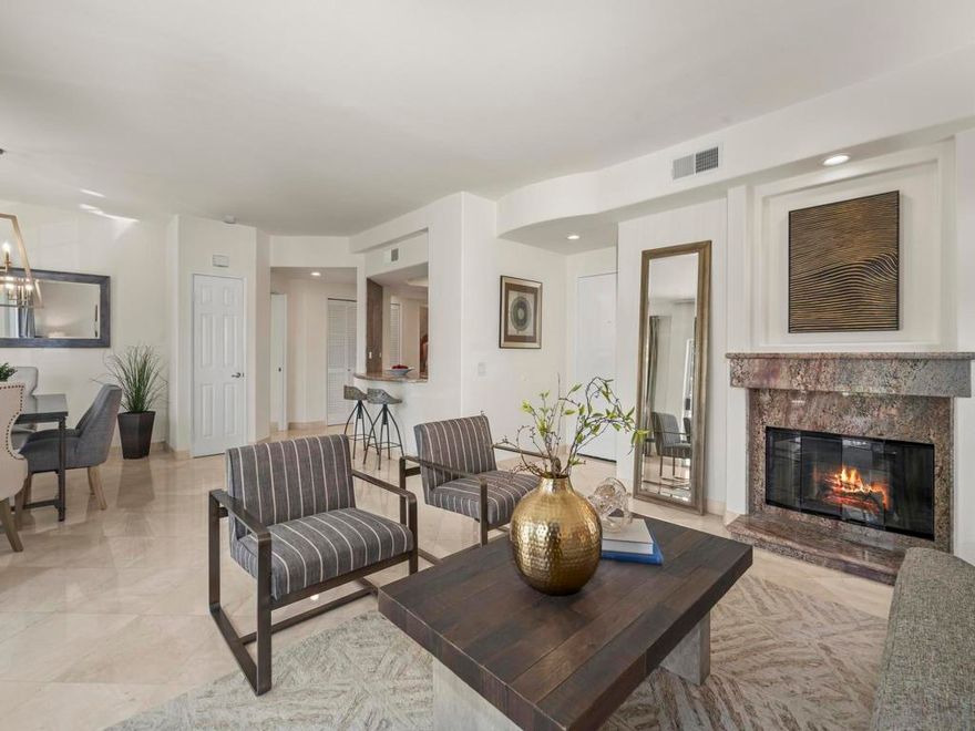 Welcome to a La Jolla residence that embodies timeless elegance and European-inspired sophistication. This beautifully upgraded 2-bedroom, 2-bath condominium offers 1,359 sq. ft. of refined living space in one of Southern California’s most desirable coastal communities. Perfectly situated west of the I-5, the home combines convenience and exclusivity, with effortless access to La Jolla’s world-class beaches, shopping, dining, and culture. Inside, striking marble tile flooring creates an immediate sense of refinement. The renovated kitchen is a culinary highlight, showcasing custom cabinetry, stainless steel appliances, and rich granite countertops with a matching backsplash. Designed for entertaining, the open-concept floor plan flows seamlessly into the dining and living areas. The inviting living room features a granite-accented fireplace and expansive windows that bathe the space in natural light. A sliding glass door opens to a private balcony, ideal for enjoying the coastal breeze. The primary suite offers a spa-inspired retreat, while the second bedroom provides flexibility for guests, office, or lifestyle needs. Additional highlights include new lighting, a dining room chandelier, and two single-car garages, one with adjacent storage room. The well-maintained community offers tranquil walkways, shade trees, a pet area, sparkling pool, and two spas. With its prime location and high-end finishes, this home delivers the perfect balance of luxury, convenience, and coastal charm.