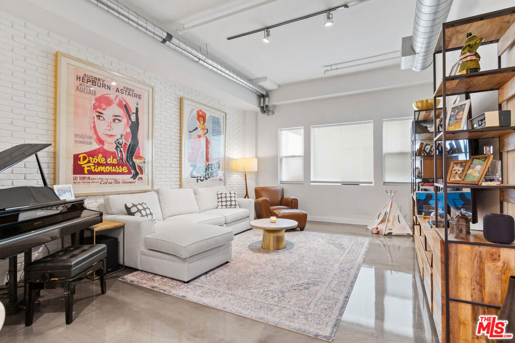 An absolute gem in the vibrant Historic Core of Downtown Los Angeles. The chic unit highlights one of the larger square footage floor plans with two cozy bedrooms, high ceilings, and modern/industrial updates throughout. Immerse yourself in the energy of Downtown LA with trendy hotels & cafes, chic boutiques, and cultural landmarks right at your doorstep. Whether you're exploring the city or seeking a private escape, this home is the perfect launchpad for your urban adventure. The Building amenities include 24/7 front desk & security, on-site management, a theater room, a rooftop sun deck with a pool, spa, cabanas, gym, and some of the most iconic views of Downtown LA that you will find. Upgrades include California custom closets, epoxy flooring, Wolf kitchen appliances, custom faux brick panels, and an expanded chef's kitchen with expansive shelving, additional cabinets and countertop, and a wine storage unit. Parking is across the street and a separate fee.