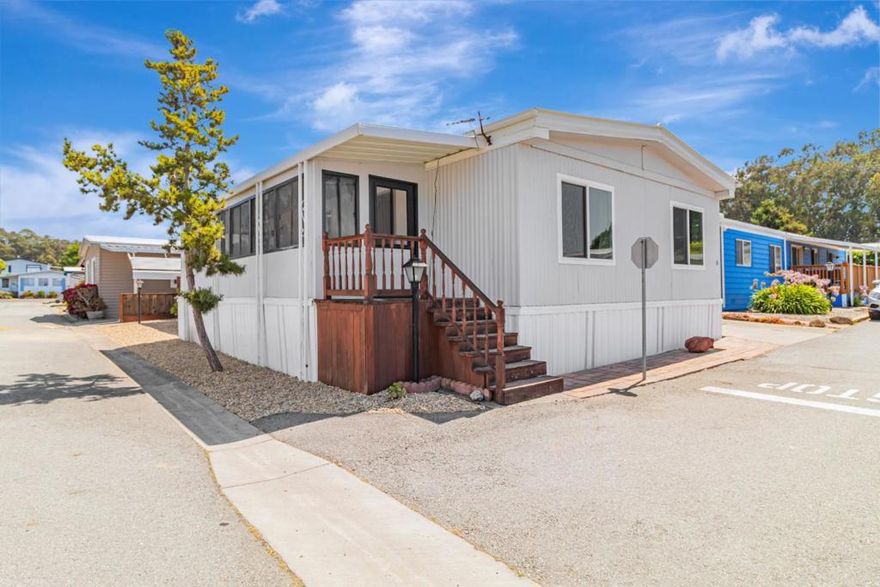 Welcome to the desirable 55+ community of Canada Cove located in beautiful Half Moon Bay!  Situated on a desirable corner lot, 8 Coral Way consists of a spacious 2 bedroom 2 bathroom manufactured home offering 1440 square feet of comfortable living space with carport and a paved seating area. Just wait until you see this unique c-shaped, sun filled kitchen with an oversized skylight. The spacious floorplan is your empty canvas to create your personal touches.  The dining room has a built-in buffet and both bedrooms have walk-in closets with cedar flooring. Located less than one mile from the beach and adjacent to a scenic golf course and the Ritz Carlton. The community features outstanding amenities including a saline swimming pool, bocce ball, clubhouse with full gym, game room, exercise classes, bingo, kitchen and laundry room.  A dog park and gated trail provides easy access to the beach. Affordably priced, perfect for your weekend get away or full time residence.  Enjoy Coastal living at its finest.