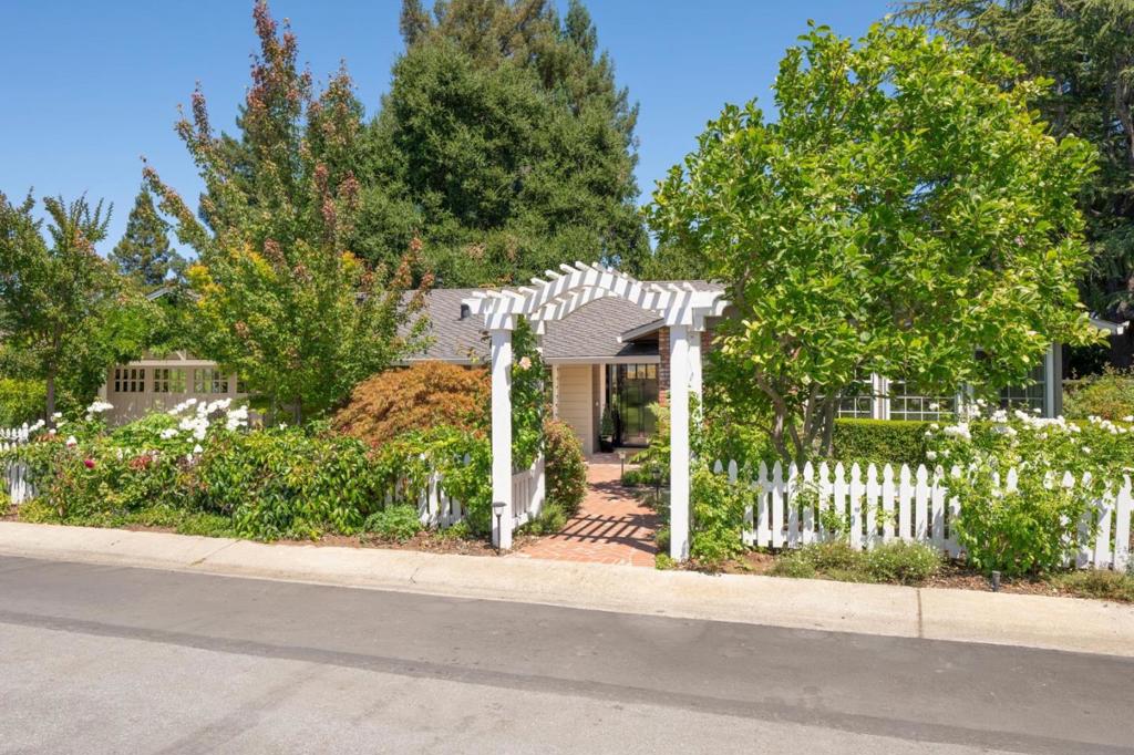 In prime downtown Los Altos, only a block from the Village, this beautifully remodeled ranch home blends classic appeal with modern luxury. The light-filled living dining great room is ideal for gathering with family and friends. Cooking is a pleasure in the elegant chef's kitchen which opens to the outdoor entertaining deck and cozy family room. Work from home and distance learning are perfectly accommodated in the comfortable front office while the primary suite with its sumptuous designer bath provides a serene retreat at the end of the day. Exquisitely curated gardens surrounding the home create a lush landscape of climbing roses, manicured paths, and a flourishing orchard which invite true California outdoor living year-round. Become a part of the community and enjoy top rated schools, Lincoln Park, boutiques, cafes and the famous First Friday Monthly Music festival all in close proximity!